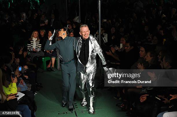 Designer Jean Paul Gaultier walks the runway alongside a model during the finale of the Jean Paul Gaultier show as part of the Paris Fashion Week...