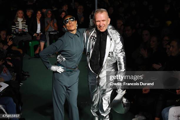 Designer Jean Paul Gaultier walks the runway alongside a model during the finale of the Jean Paul Gaultier show as part of the Paris Fashion Week...