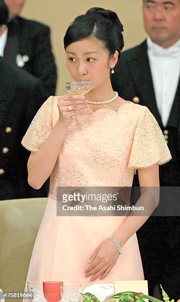 Princess Kako of Akishino drinks a glass of champagne during the state dinner inviting Philippine President Benigno Aquino at the Imperial Palace on...
