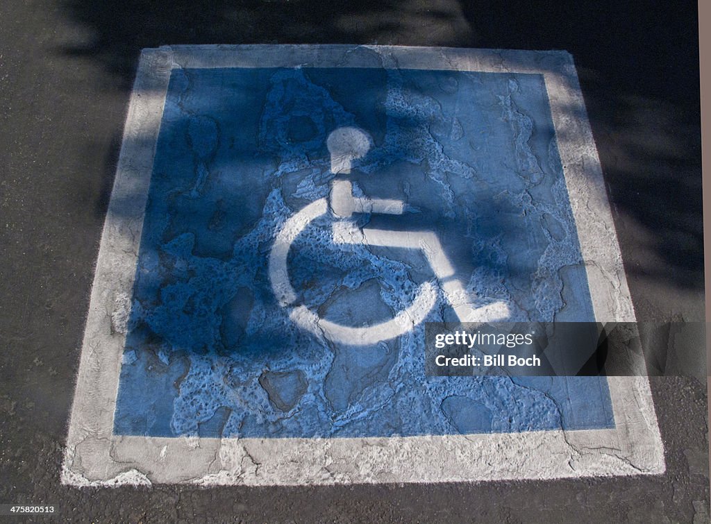 Distressed handicap parking symbol