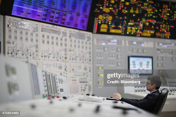 An employee monitors control systems in the operations room at the Novovoronezh NPP nuclear power station, operated by OAO Rosenergoatom, a unit of...