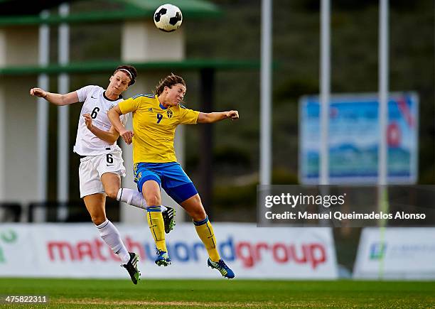 Jasmine Matthews of England competes for the ball with Pauline Hammarlund of Sweden during the U-23 friendly match between England and Sweden at la...