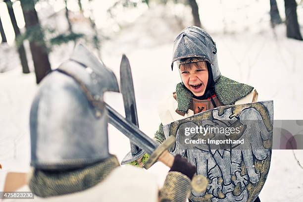 little knights fighting in frozen forest - chain mail stock pictures, royalty-free photos & images