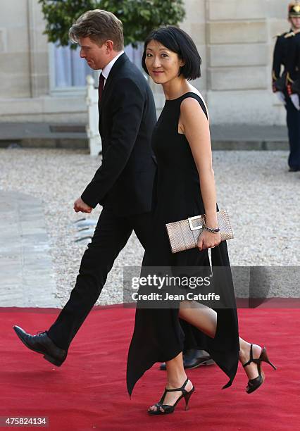 Fleur Pellerin and her husband Laurent Olleon arrive at the State Dinner offered by French President Francois Hollande in honor to the King and Queen...