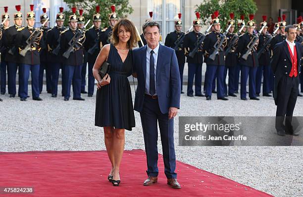 Francois Cluzet and his wife Narjiss Cluzet arrive at the State Dinner offered by French President Francois Hollande in honor to the King and Queen...