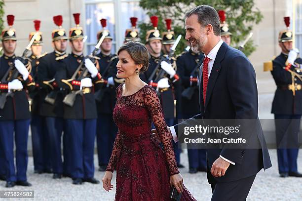 Her Majesty The Queen Letizia of Spain and His Majesty The King Felipe VI of Spain arrive at the State Dinner in their honor at the Elysee Palace on...