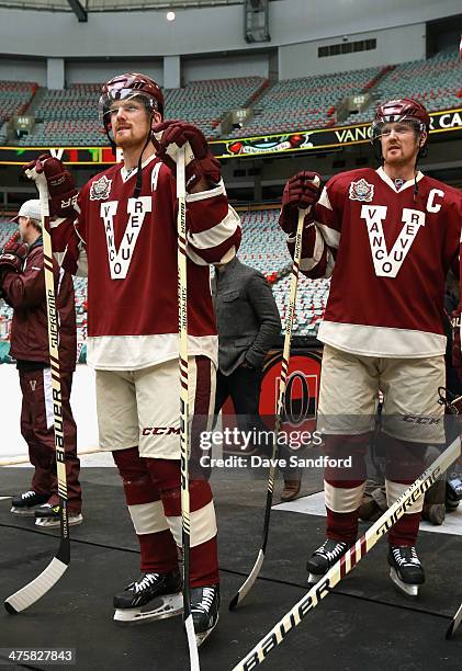 Daniel Sedin and Henrik Sedin of the Vancouver Canucks attend practice for the 2014 Tim Hortons NHL Heritage Classic game against the Ottawa Senators...