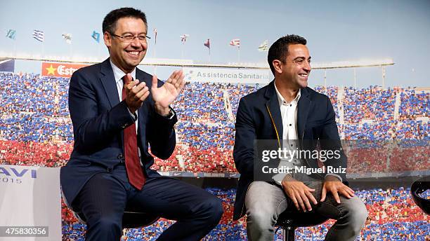 Club President Josep Maria Bartomeu applauds Xavi Hernandez during the 'FC Barcelona Homage to Xavi' ahead of his final game for the club at Camp Nou...