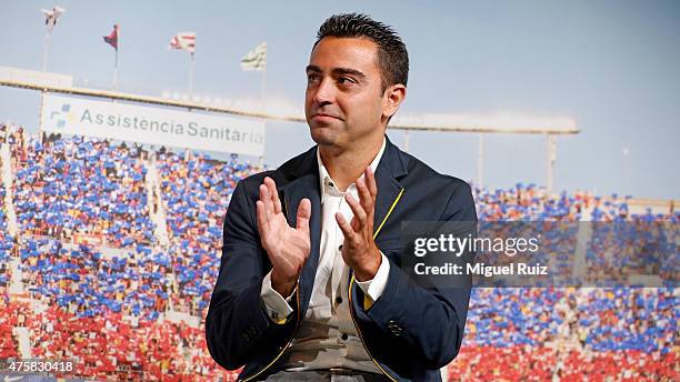 Xavi Hernandez applauds during the 'FC Barcelona Homage to Xavi' ahead of his final game for the club at Camp Nou on June 3, 2015 in Barcelona, Spain.