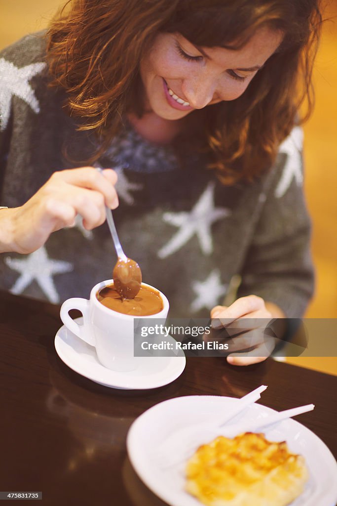 Pretty woman with cup of hot chocolate