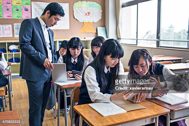 japanese kids working with digital tablets at school - japan 12 years girl stock pictures, royalty-free photos & images
