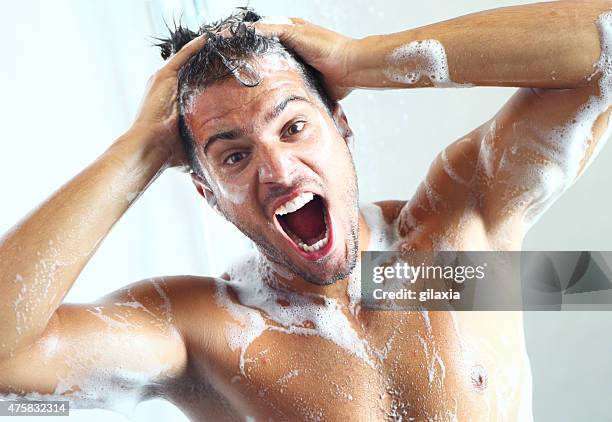 guy taking a shower and suddenly soap meets his eyes. - man open mouth stock pictures, royalty-free photos & images