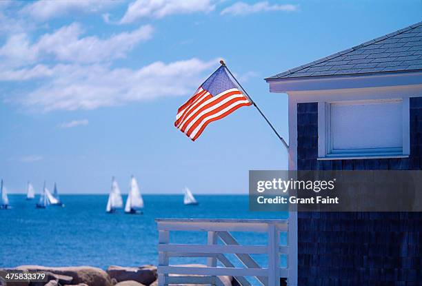 view of sea near public boat house - american flag ocean stock pictures, royalty-free photos & images