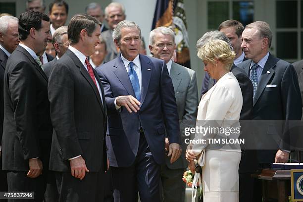 President George W. Bush talks with Senate Majority Leader Bill Frist , R-TN, Sen. Rick Santorum , R-PA, Rep. Mark Foley , R-FL, Reve Walsh ( and...