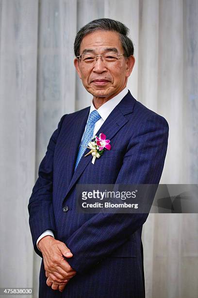 Akira Kiyota, president of Tokyo Stock Exchange Inc., poses for a photograph at the opening of the Singapore branch of the Tokyo Stock Exchange Inc....