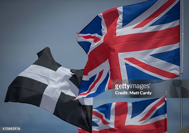 The Cornish flag flutters alongside Union Jack flags displayed on the opening day of the Royal Cornwall Show near Wadebridge on June 4, 2015 in...