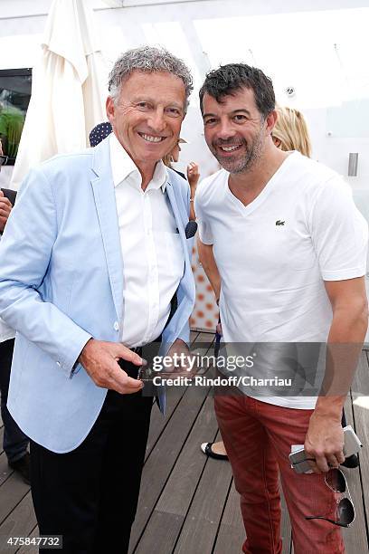 Journalist Nelson Monfort and TV Host Stephane Plaza attend the 2015 Roland Garros French Tennis Open - Day Twelve, on June 4, 2015 in Paris, France.