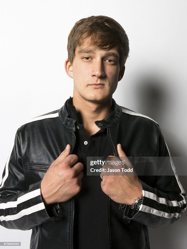 Young man on white in leather jacket