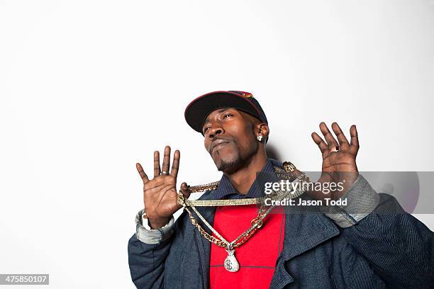 man flaunting goldchains with money bag emblam - bling bling stock pictures, royalty-free photos & images