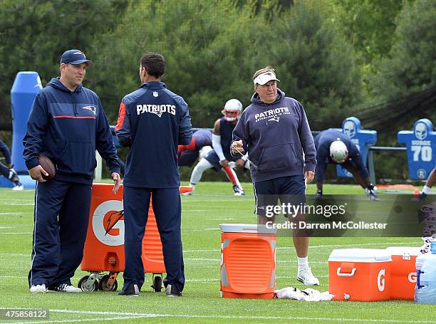 Head coach Bill Belichick of the New England Patriots spins his whistle during organized team activities at Gillette Stadium on June 4, 2015 in...