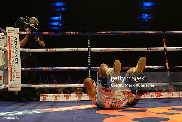 Hector Avila receives a count after being knocked dow by Anthony Joshua during an undercard bout at the WBO World Lightweight Championship Boxing...