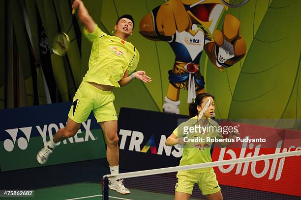 Xu Chen and Ma Jin of China return a shot against Solgyu Choi and Eom Hye Won of Korea during the 2015 BCA Indonesia Open Round 2 match on June 4,...