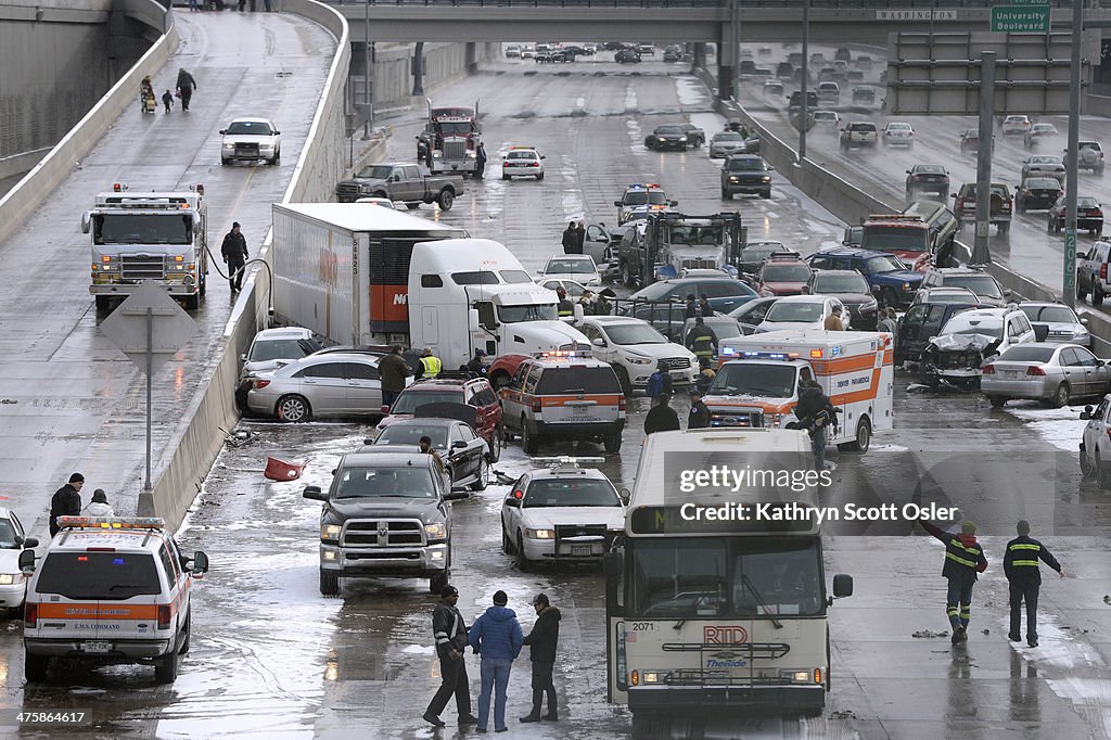 One person was killed and 20 people were taken to three hospitals with injuries Saturday morning in a giant pileup on north bound Interstate 25 as a band of heavy snow moved through Denver.