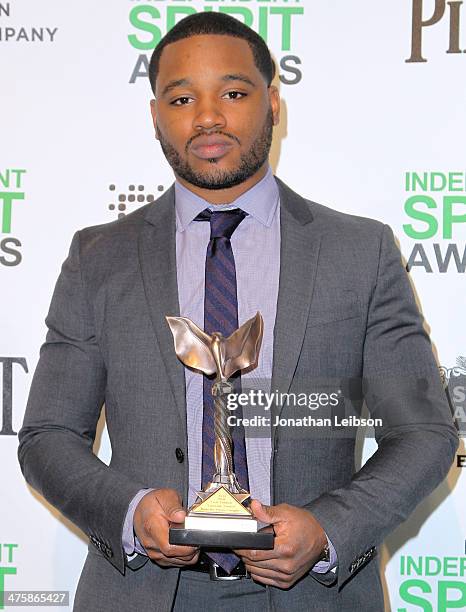 Director Ryan Coogler poses with the Best First Feature Award for 'Fruitvale Station' in the press room during the 2014 Film Independent Spirit...