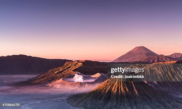 sunrise over bromo and semeru volcanoes in indonesia - mt bromo stock pictures, royalty-free photos & images