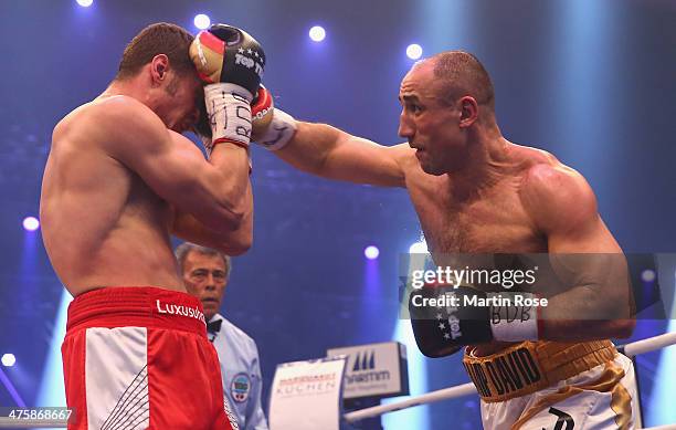 Robert Stieglitz of Germany and Arthur Abraham of Germany exchange punches during the WBO World Championship Super Middleweight title fight at Getec...