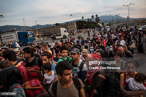 Hundreds of migrant men, women and children along with tourists and locals board a ferry bound for Athens on June 04, 2015 in Kos, Greece. Many...