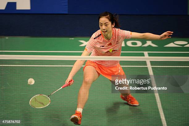 Wang Shixian of China returns a shot against Bae Yeon Ju of Korea during the 2015 BCA Indonesia Open Round 2 match on June 4, 2015 in Jakarta,...
