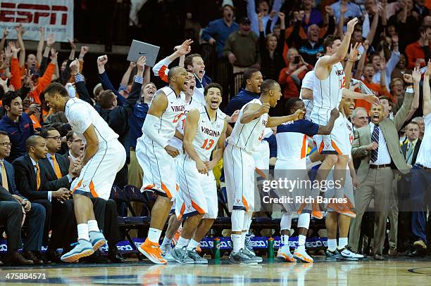 Virginia Cavaliers players celebrate against the Syracuse Orange during the second half at John Paul Jones Arena on March 1, 2014 in Charlottesville,...