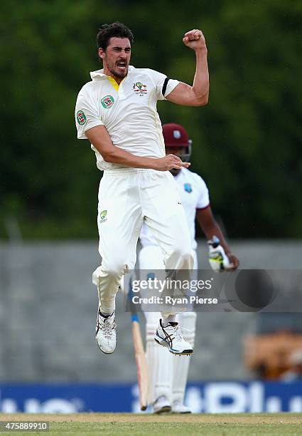 Mitchell Starc of Australia celebrates after taking the wicket of Kraigg Brathwaite of West Indies during day two of the First Test match between...