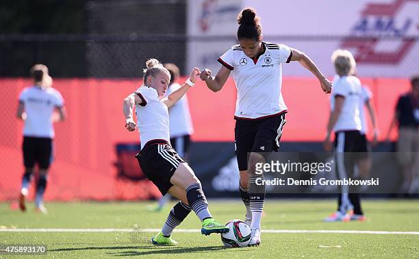 Celia Sasic and Leonie Maier of Germany battle for the ball during a training session at Richcraft Recreation Complex on June 4, 2015 in Ottawa,...