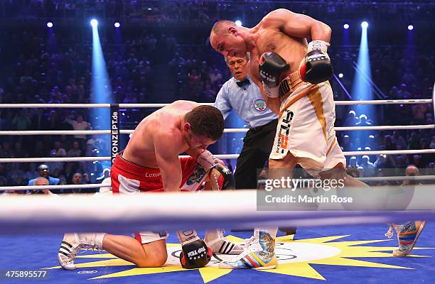 Robert Stieglitz of Germany is knpocked down by Arthur Abraham of Germany during the WBO World Championship Super Middleweight title fight at Getec...