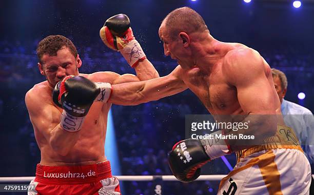 Robert Stieglitz of Germany and Arthur Abraham of Germany exchange punches during the WBO World Championship Super Middleweight title fight at Getec...
