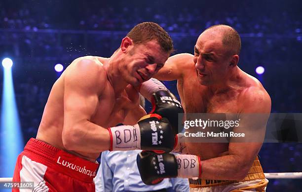 Robert Stieglitz of Germany and Arthur Abraham of Germany exchange punches during the WBO World Championship Super Middleweight title fight at Getec...