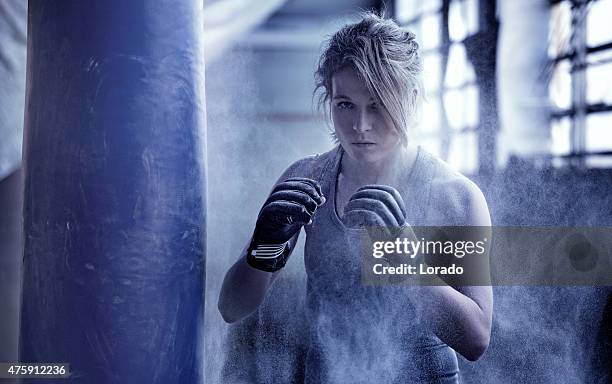 female boxer in an abandoned warehouse - fighter portraits 2015 stockfoto's en -beelden