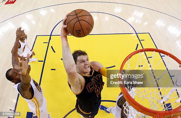 Timofey Mozgov of the Cleveland Cavaliers dunks against the Golden State Warriors in the first half during Game One of the 2015 NBA Finals at ORACLE...