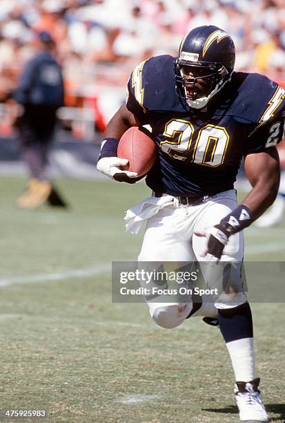 Natrone Means of the San Diego Chargers carries the ball against the Seattle Seahawks during an NFL Football game September 5, 1993 at Jack Murphy...