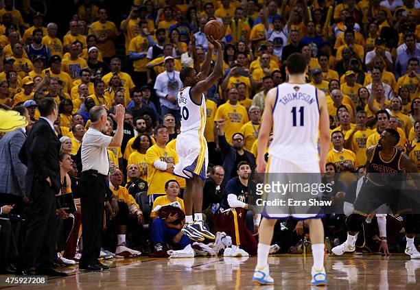 Harrison Barnes of the Golden State Warriors shoots for three in overtime against the Cleveland Cavaliers during Game One of the 2015 NBA Finals at...