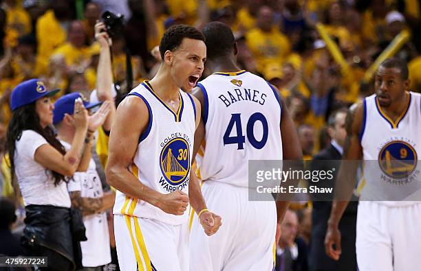 Stephen Curry of the Golden State Warriors reacts in overtime against the Cleveland Cavaliers during Game One of the 2015 NBA Finals at ORACLE Arena...