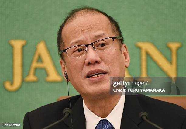Philippine President Benigno Aquino answers questions during a press conference at the Japan National Press Club in Tokyo on June 5, 2015. Aquino...