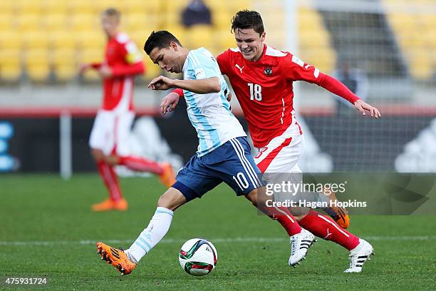 Tomas Martinez of Argentina looks to evade the defence of Martin Rasner of Austria during the FIFA U-20 World Cup New Zealand 2015 Group B match...
