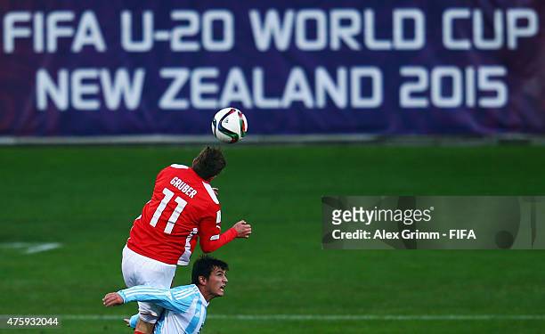 Andreas Gruber of Austria outjumps Adrian Cubas of Argentina during the FIFA U-20 World Cup New Zealand 2015 Group B match between Austria and...