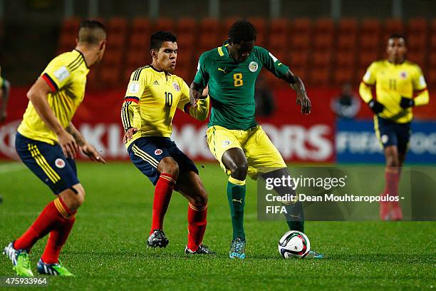 Sidy Sarr of Senegal and Sergio Villarreal of Colombia battle for the ball during the FIFA U-20 World Cup New Zealand 2015 Group C match between...