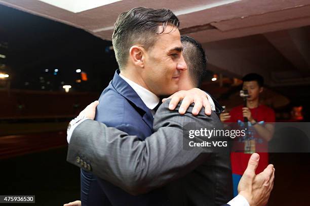 Fabio Cannavaro, Italy's World Cup winning captain and chief coach of Guangzhou Evergrande Taobao Football Club, says farewells with members of...