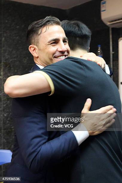 Fabio Cannavaro, Italy's World Cup winning captain and chief coach of Guangzhou Evergrande Taobao Football Club, says farewells with members of...