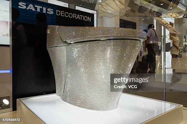 A toilet seat decorated with 72,000 Swarovski crystals is on display  News Photo - Getty Images